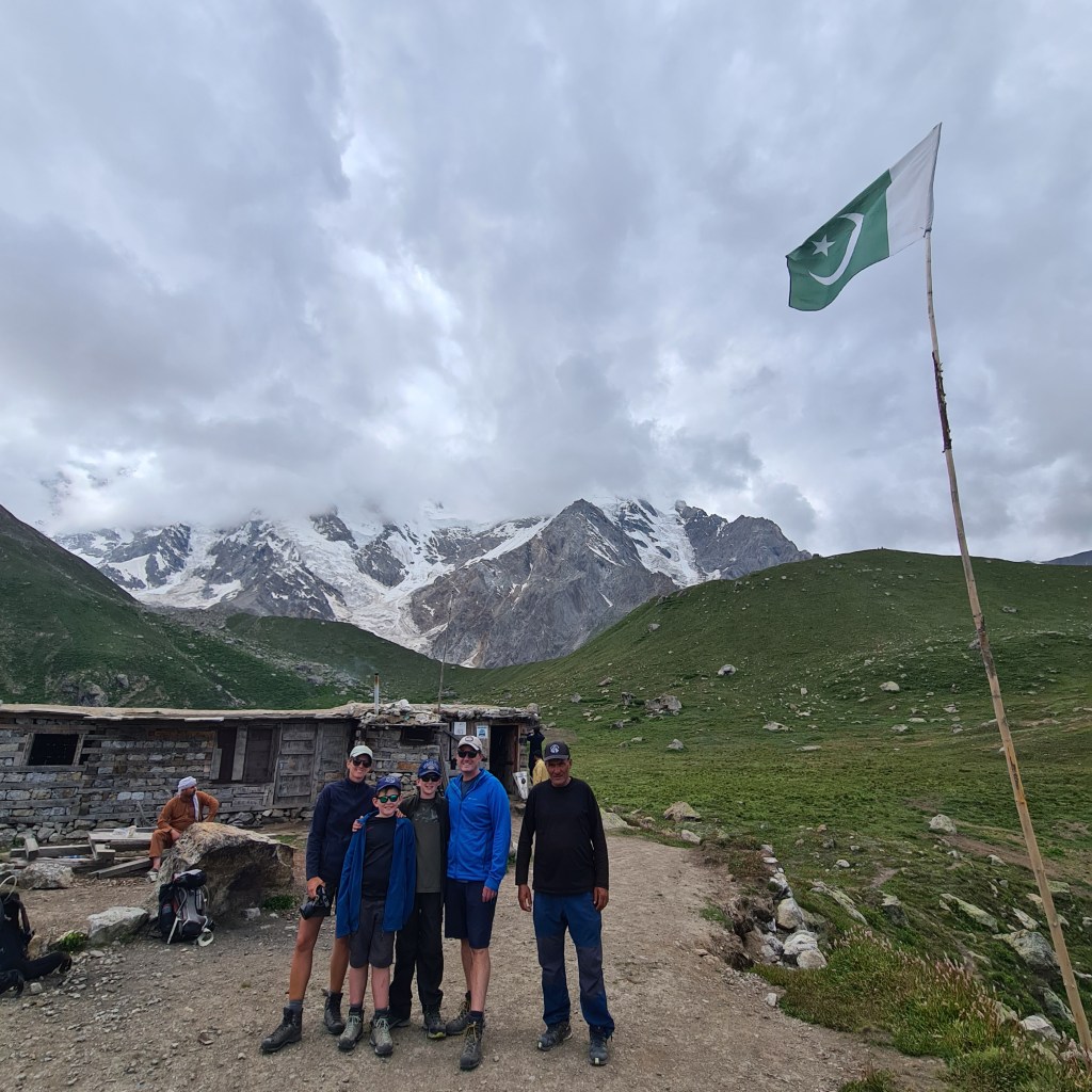 family standing in the mountains