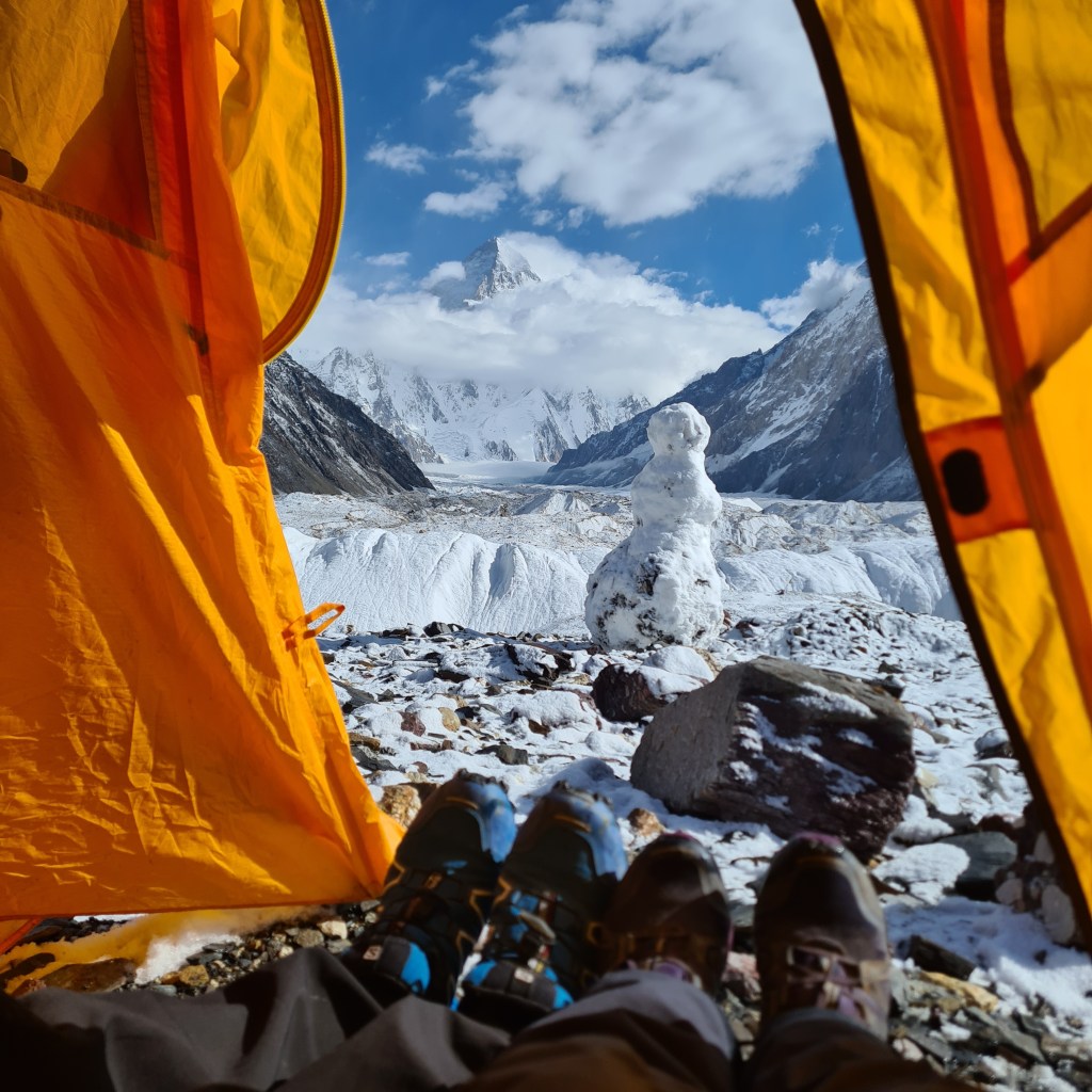 View of K2 from our Tent. You can see the snowman at the base that the boys built and K2 in the background. Only thins family would make a snowman at the base of K2