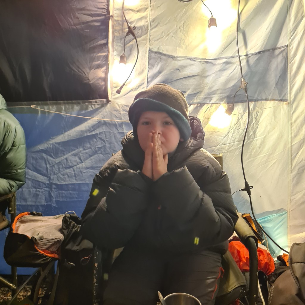 The make shift electronics set up. William in the foreground all lit up like a Christmas tree