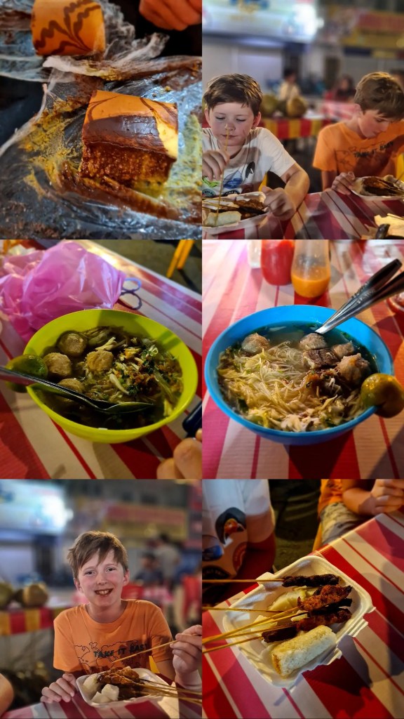 Collage showing kids enjoying local street food, including noodle soup and cakes, at an outdoor night market during a family vacation.